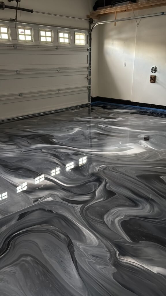 black swirl metallic concrete coating in portland garage
