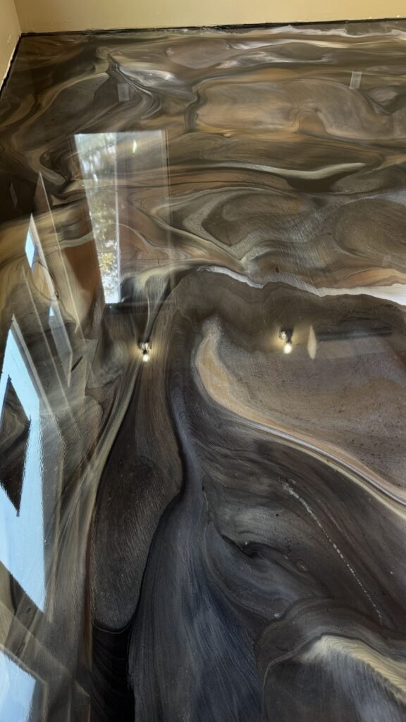 black and silver metallic epoxy floor in garage